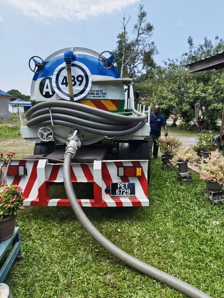 Technician servicing sewage treatment plant equipment in Kedah