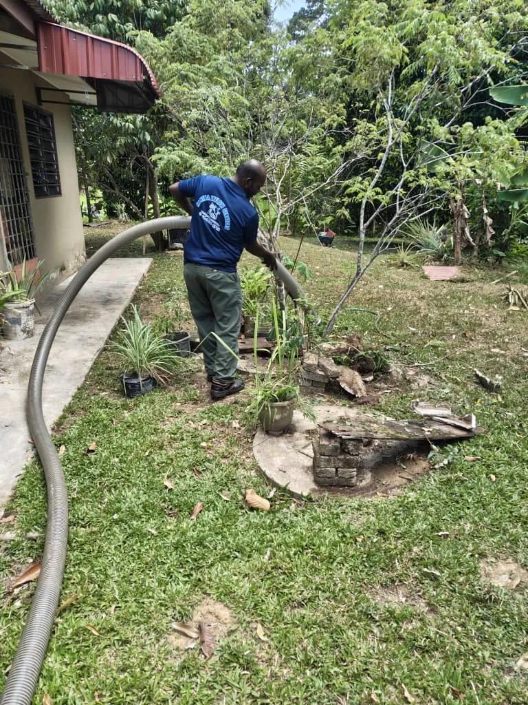 Grease trap cleaning service in a commercial kitchen in Sungai Petani